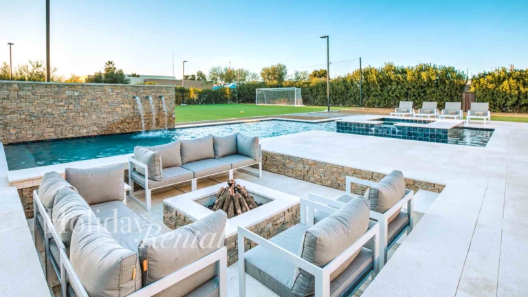 sunken seating and firepit next to pool